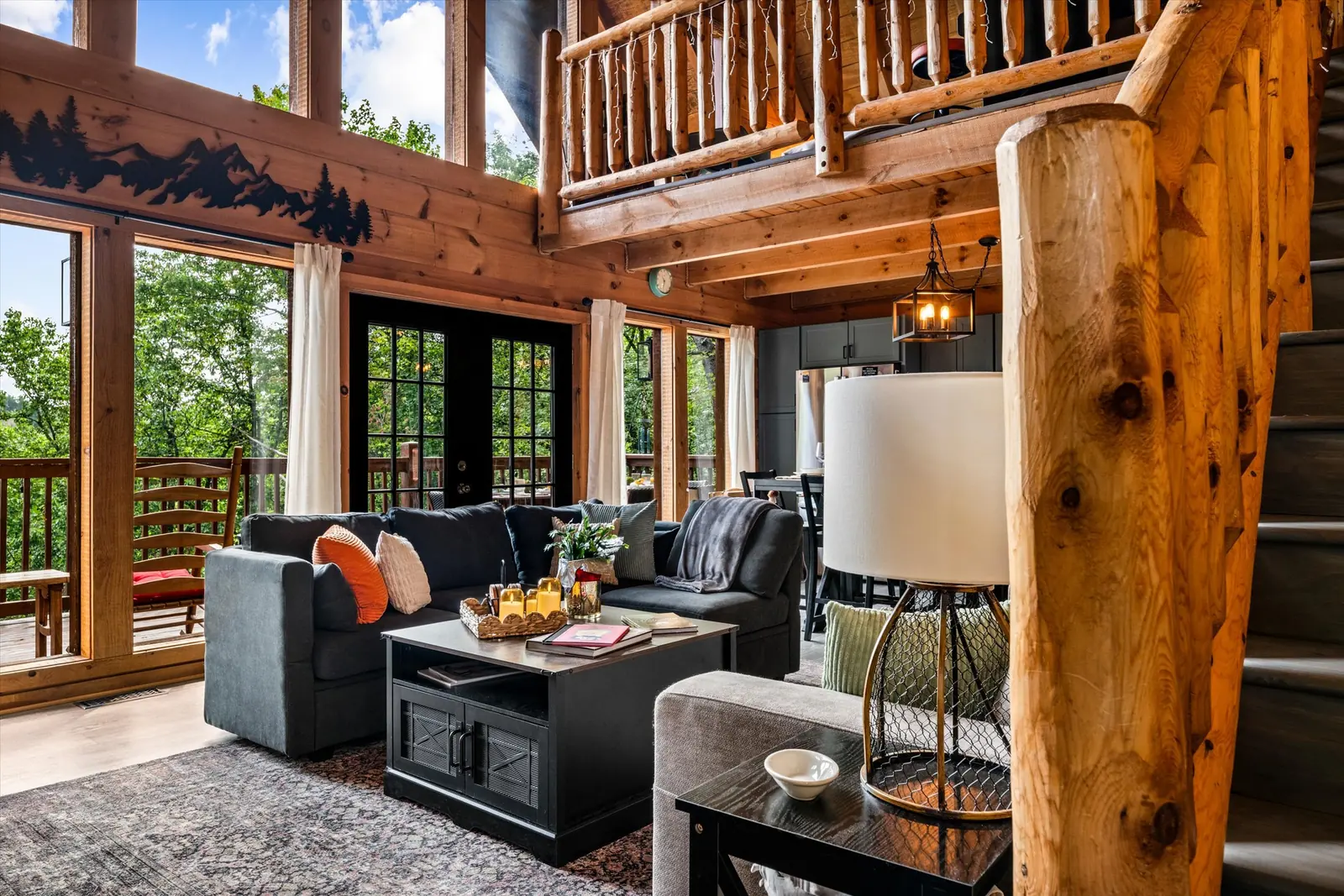 Great room at Acorn Ridge with vaulted ceiling and floor-to-ceiling windows